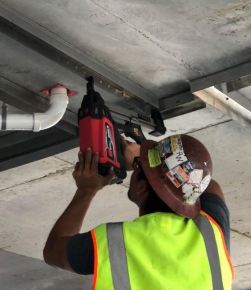 Example of gas-powered cordless nailers, an Aerosmith Track Pinner In Use